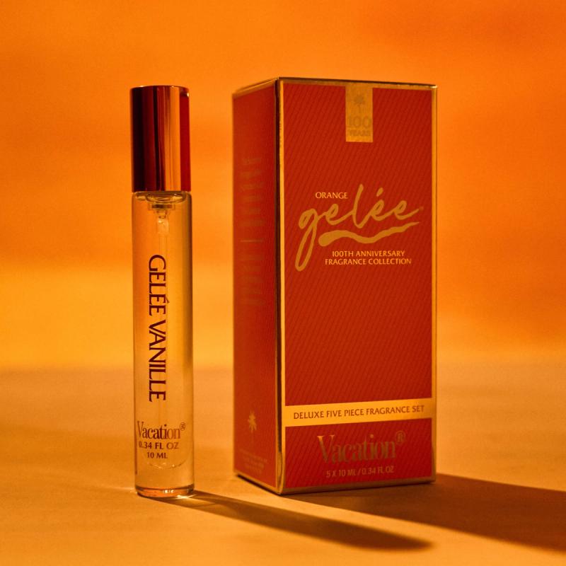 A "Vacation" brand "Gelée Vanille" rollerball fragrance and an "Orange gelée" fragrance collection box against an orange background.