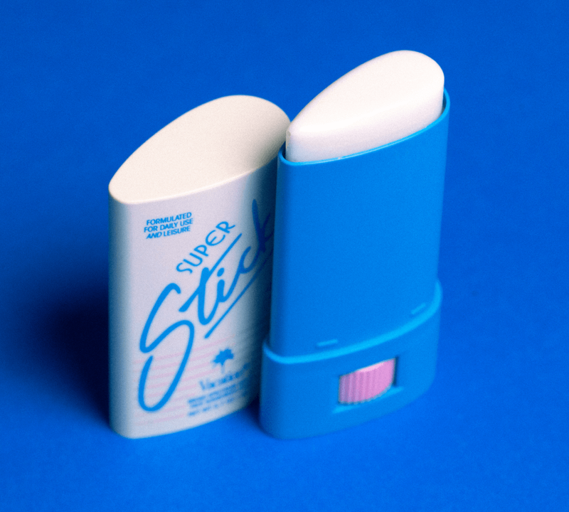 a blue and white super stick deodorant on a blue surface