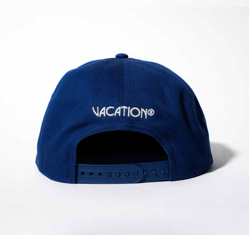 back of Super Spritz hat which reads "Vacation®"
