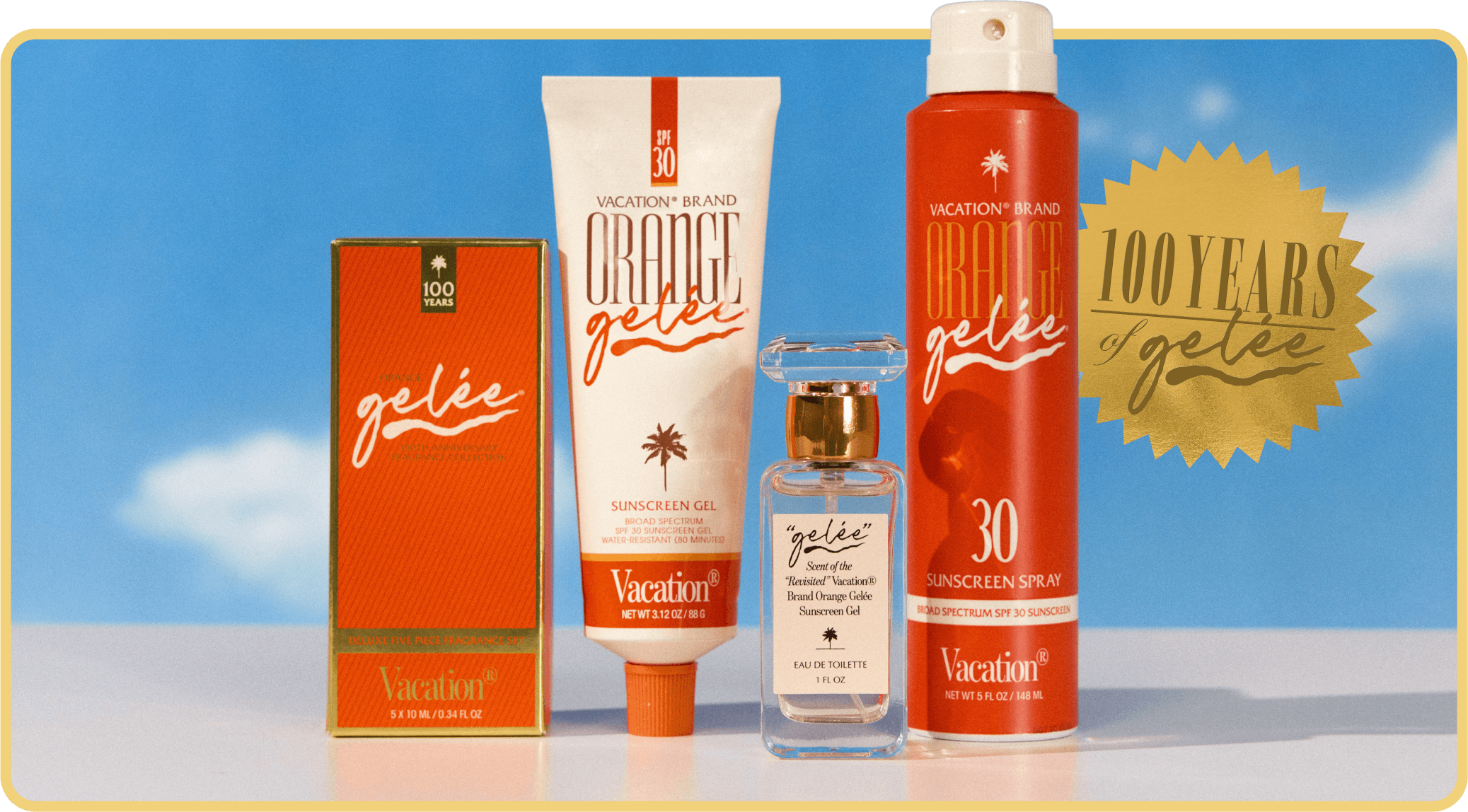 Four Vacation brand 'Gelée' products—sunscreen gel, sunscreen spray, perfume, and a box—are displayed against a blue sky with a '100 Years of Gelée' gold seal.