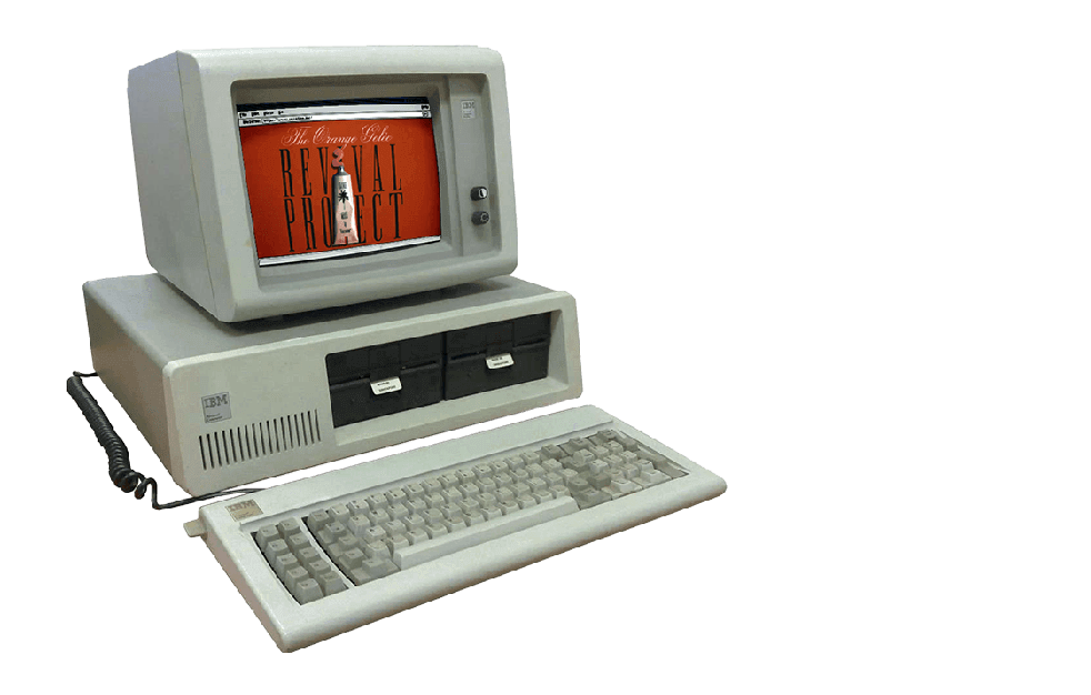 an old ibm computer with a keyboard and monitor