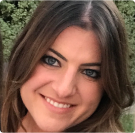 a woman with blue eyes is smiling for the camera