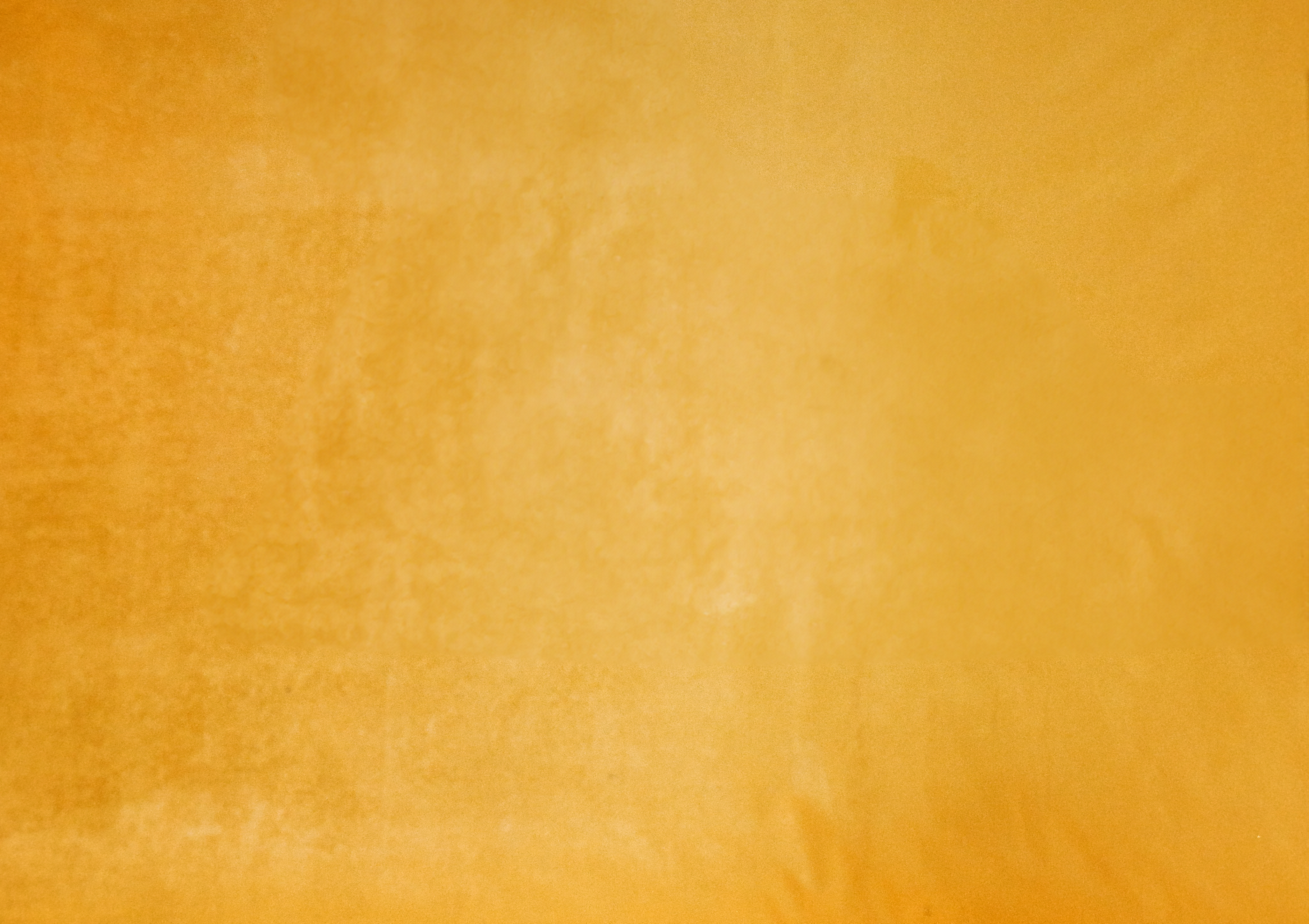 a close up of a piece of gold paper