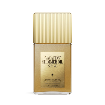 a bottle of "VACATION" shimmer oil spf 30