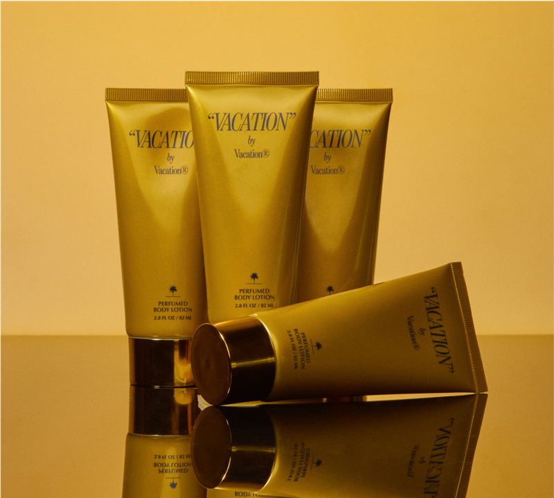 four tubes of "VACATION" by Vacation® on a gold mirrored surface