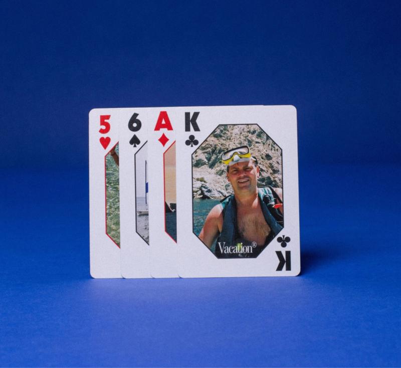 a playing card with a picture of a man snorkeling on it