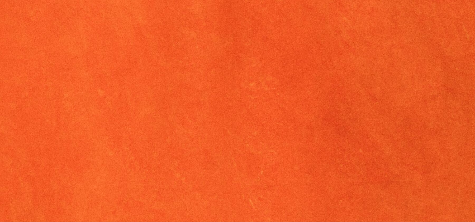 a close up of a piece of orange paper .