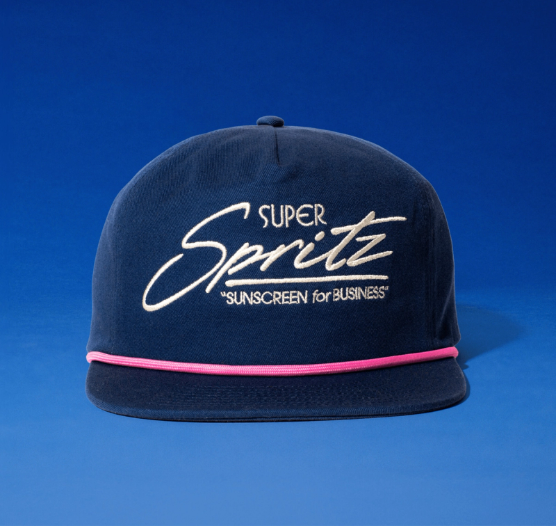 a blue Super Spritz hat on a blue background