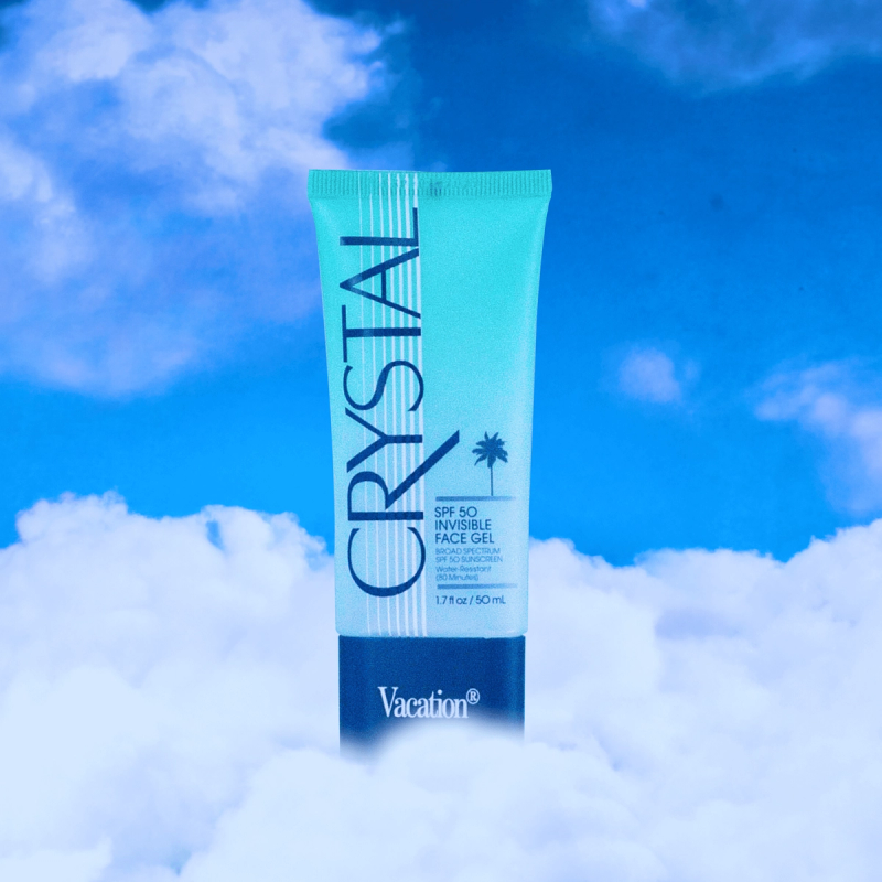 a tube of Vacation® Crystal SPF 50 Invisible Face Gel in clouds