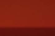 A background split horizontally into a lighter red top and a darker red bottom.