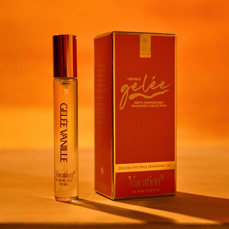 A clear rollerball perfume labeled "GELÉE VANILLE" next to an orange box for the "ORANGE gelée 100th Anniversary Fragrance Collection" by Vacation.