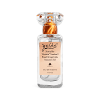Clear perfume bottle with an orange label for 'gélée' Scent of the 'Revisited' Vacation® Orange Gelée Sunscreen Gel Eau de Toilette.