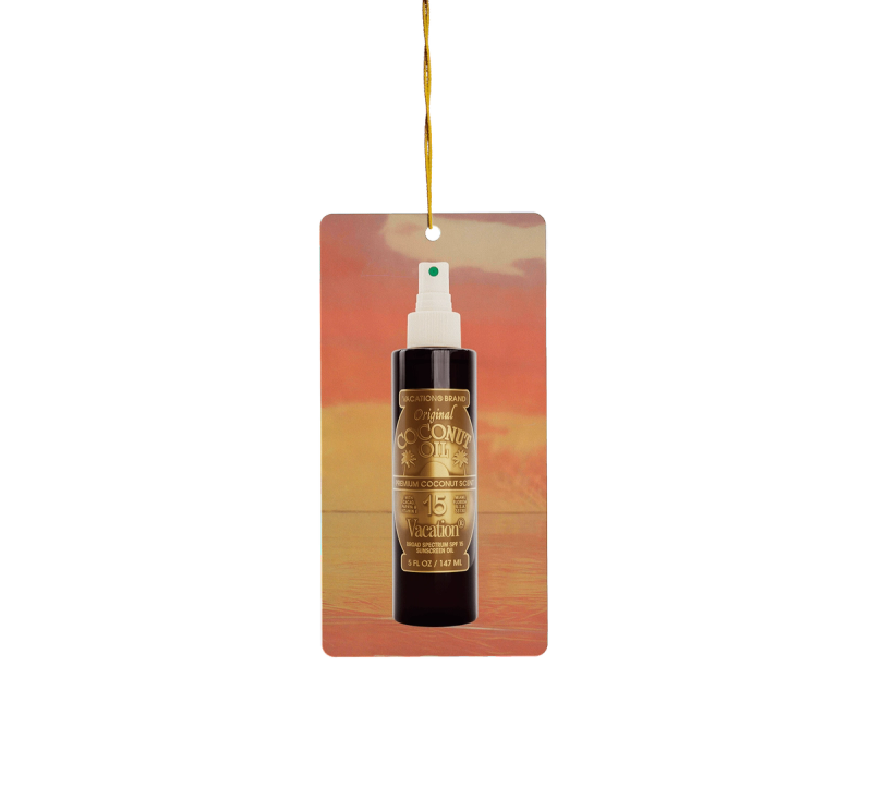 A white tube of Vacation Brand Orange Gelée Sunscreen Gel with an orange cap hangs from a red tag.