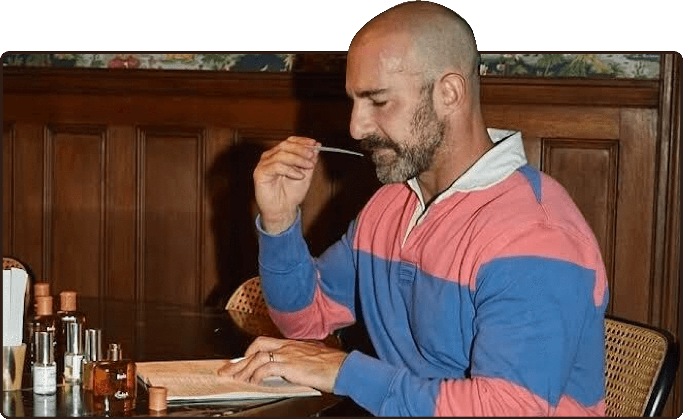 a man stands next to a tube of justice glaze