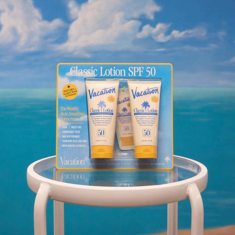 Vacation Classic Lotion SPF 50 sunscreen multi-pack against a blue sky and ocean background.