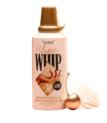 a can of Classic Whip Glow with a dollop of sunscreen and a gold cherry