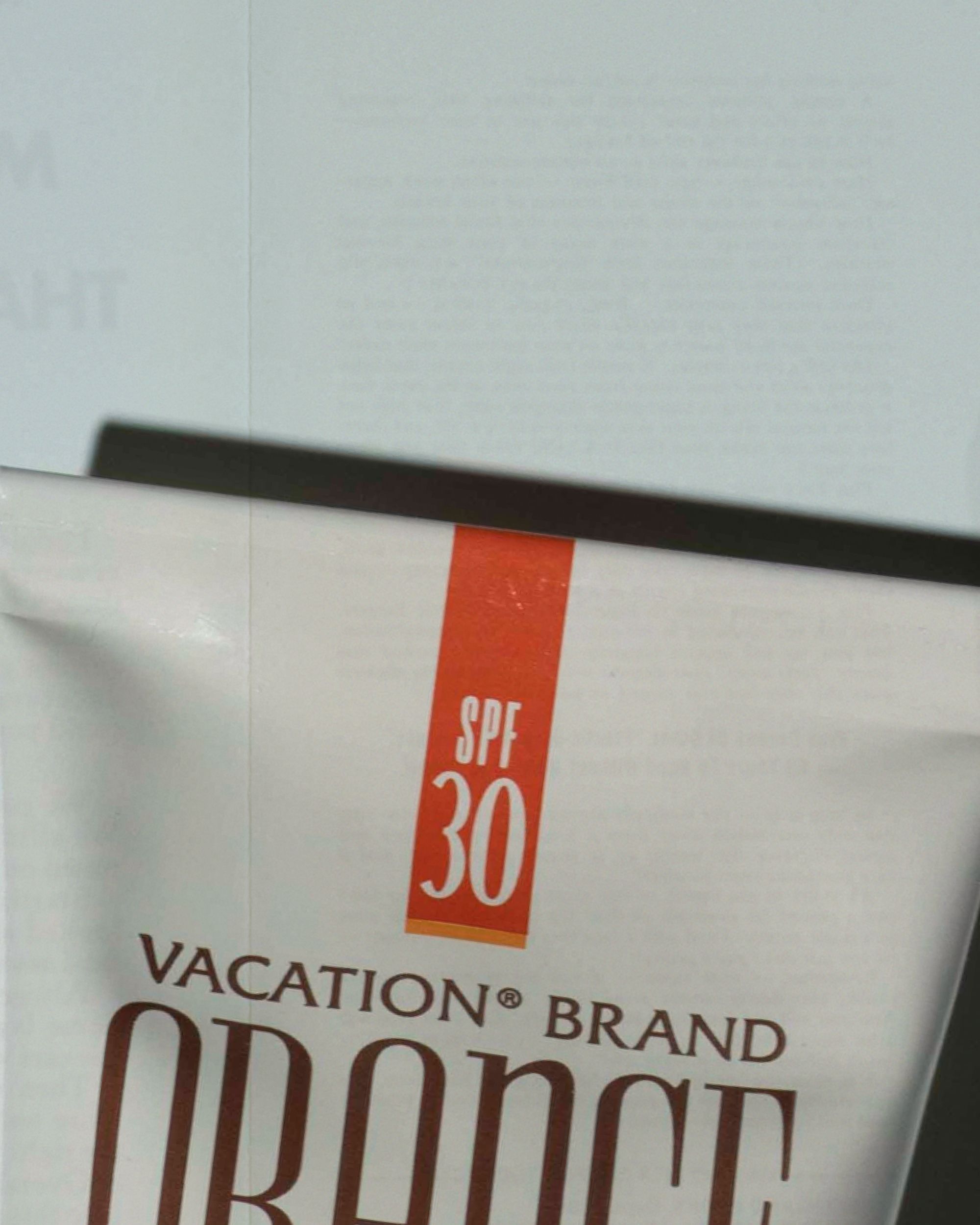 a tube of vacation brand orange spf 30 sunscreen