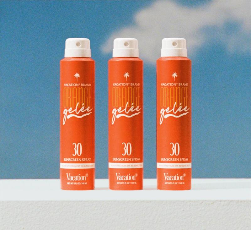 three bottles of vacation brand orange gelee sunscreen spray