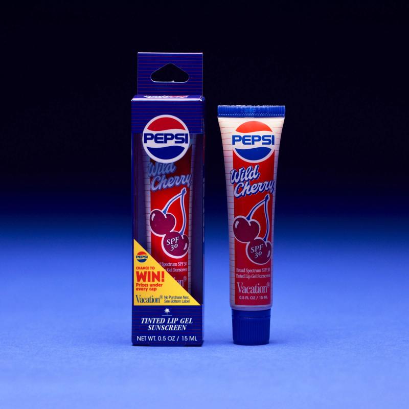 Pepsi Wild Cherry SPF 30 Tinted Lip Gel Sunscreen in a tube and its retail box.