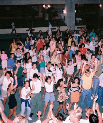 a group of people are dancing