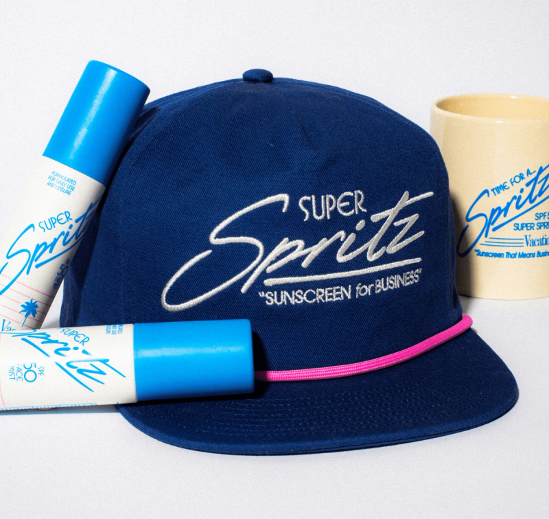 a Super Spritz hat with 2 Super Spritz and a Business mug