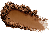 a pile of brown powder on a white background