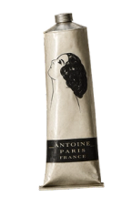 Vintage tube for Antoine Paris France, featuring a woman's profile illustration.