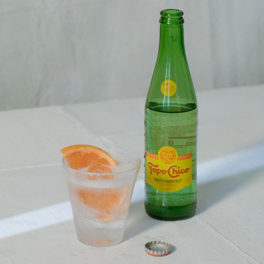 Rosaluna Topo Chico cocktail with grapefruit garnish