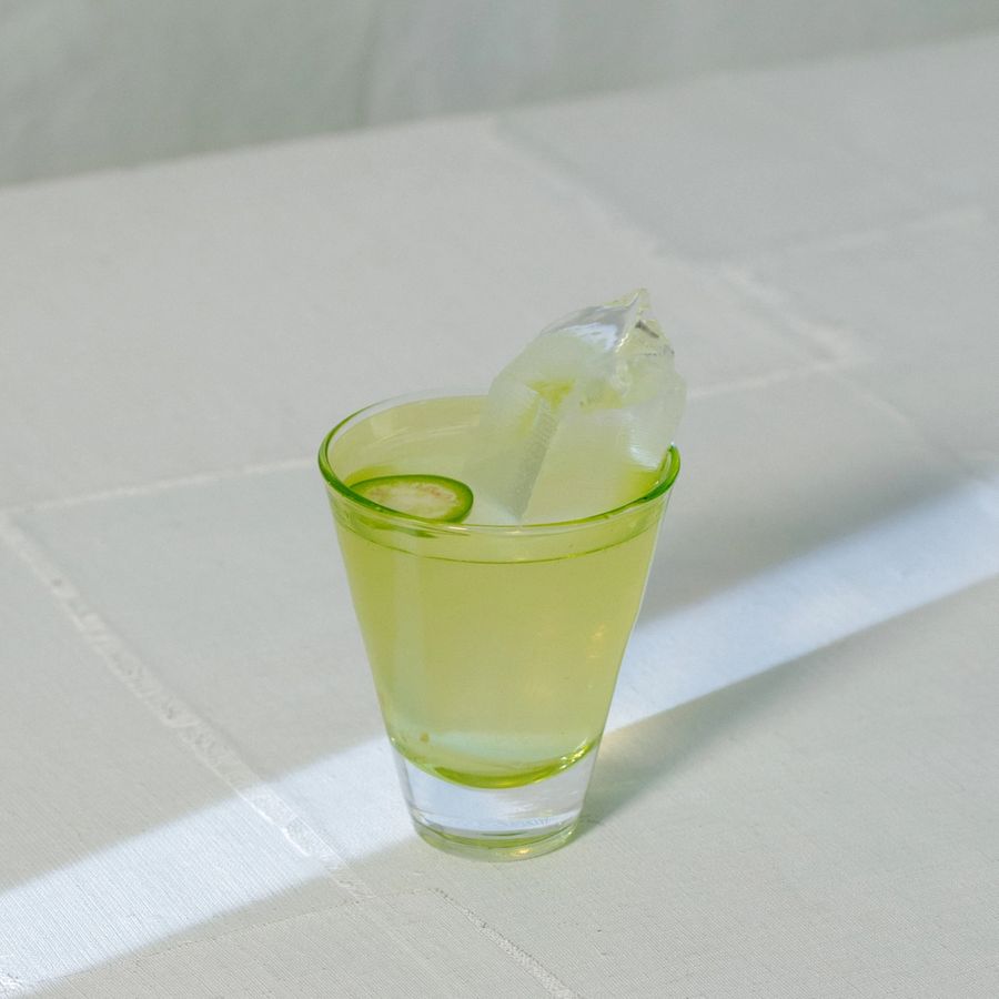 Rosaluna skyrocket cocktail with jalapeño garnish