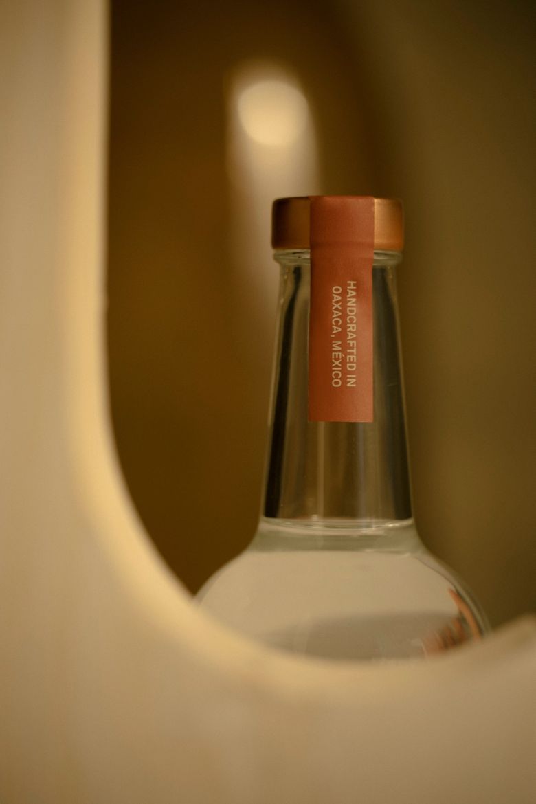 Close up of Rosaluna bottle label, reading "Handcrafted in Oaxaca, Mexico"