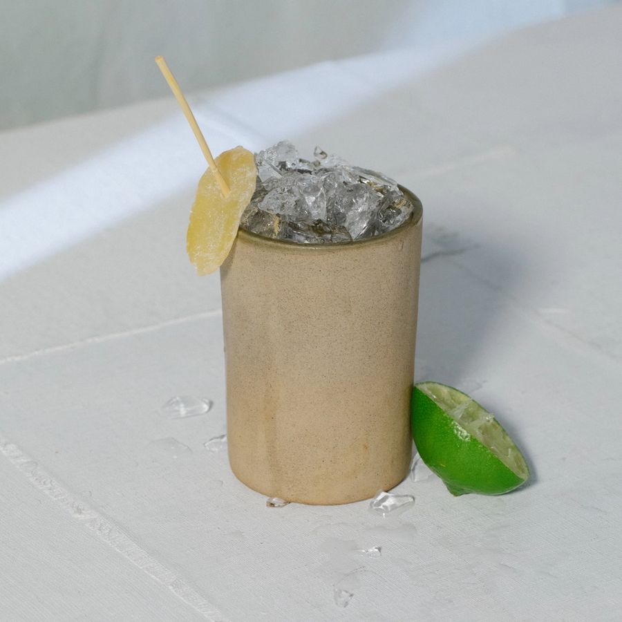 Rosaluna Mezcal Mule with candied ginger and lime garnish
