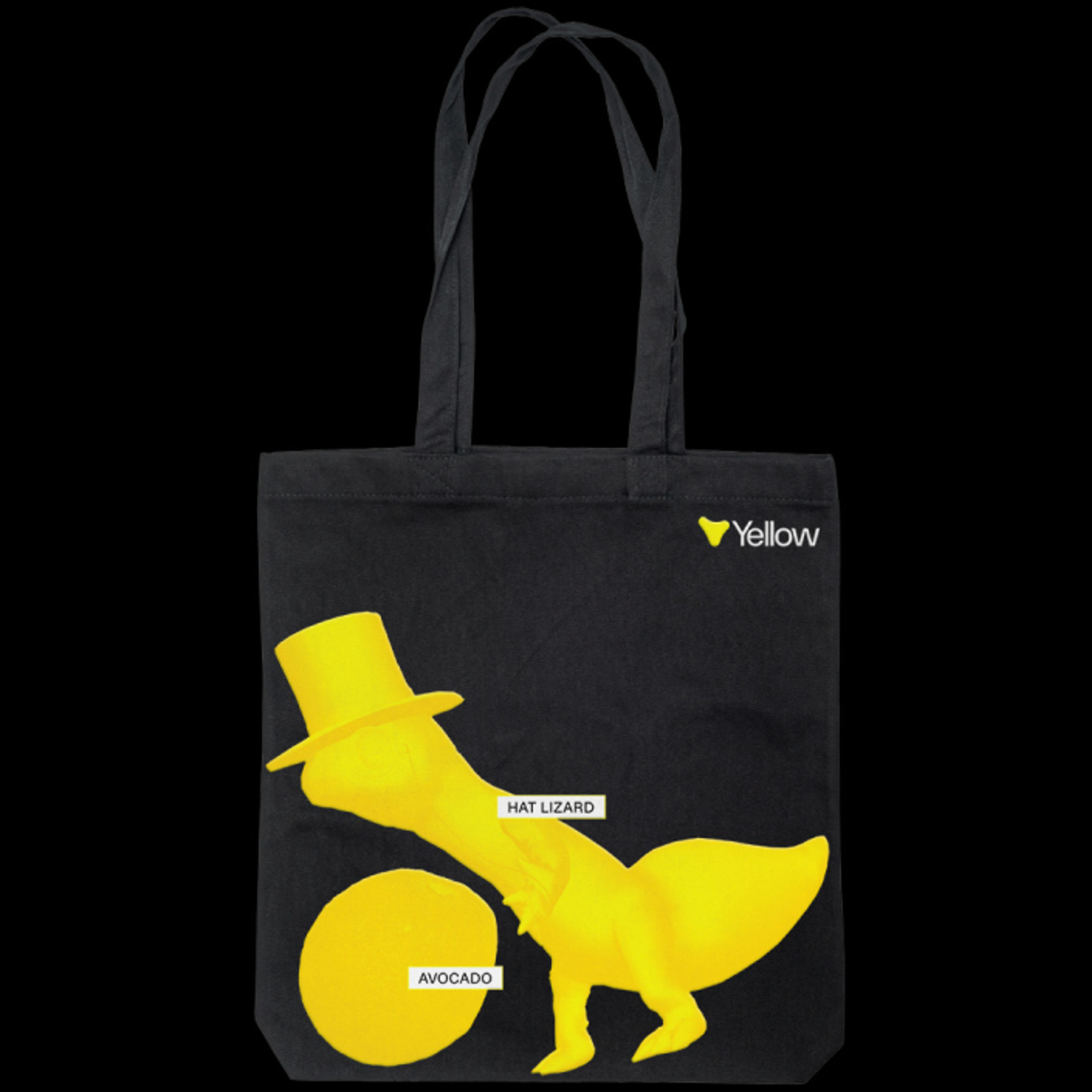 A Yellow branded black tote bag with an image of the tophat lizard and an avocado, both with prompt tags labeling them.. Copyright Cotton Design, Talia Cotton