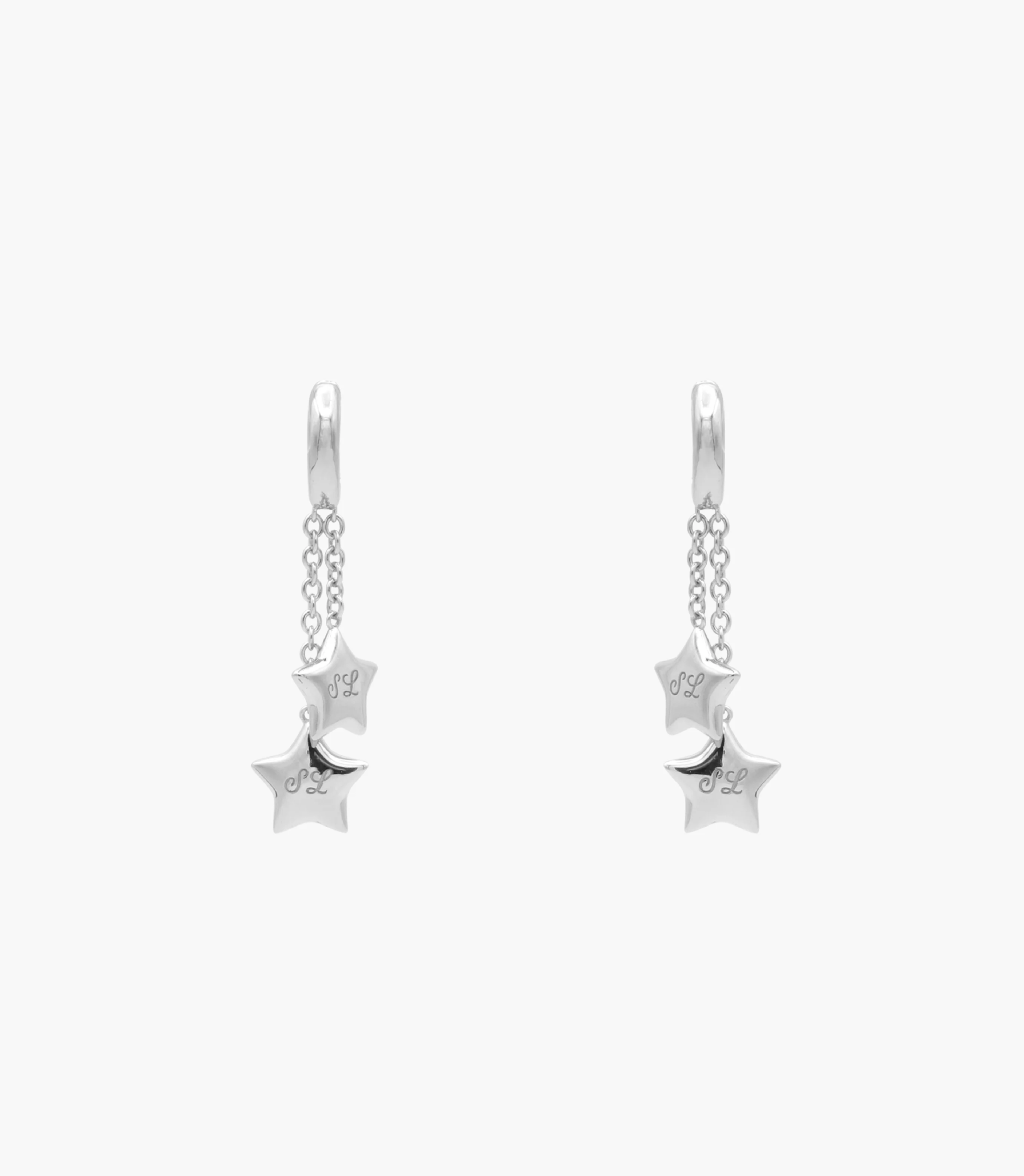 Sandy Liang silver star earrings with script "SL" acronym. Copyright Cotton Design, Talia Cotton