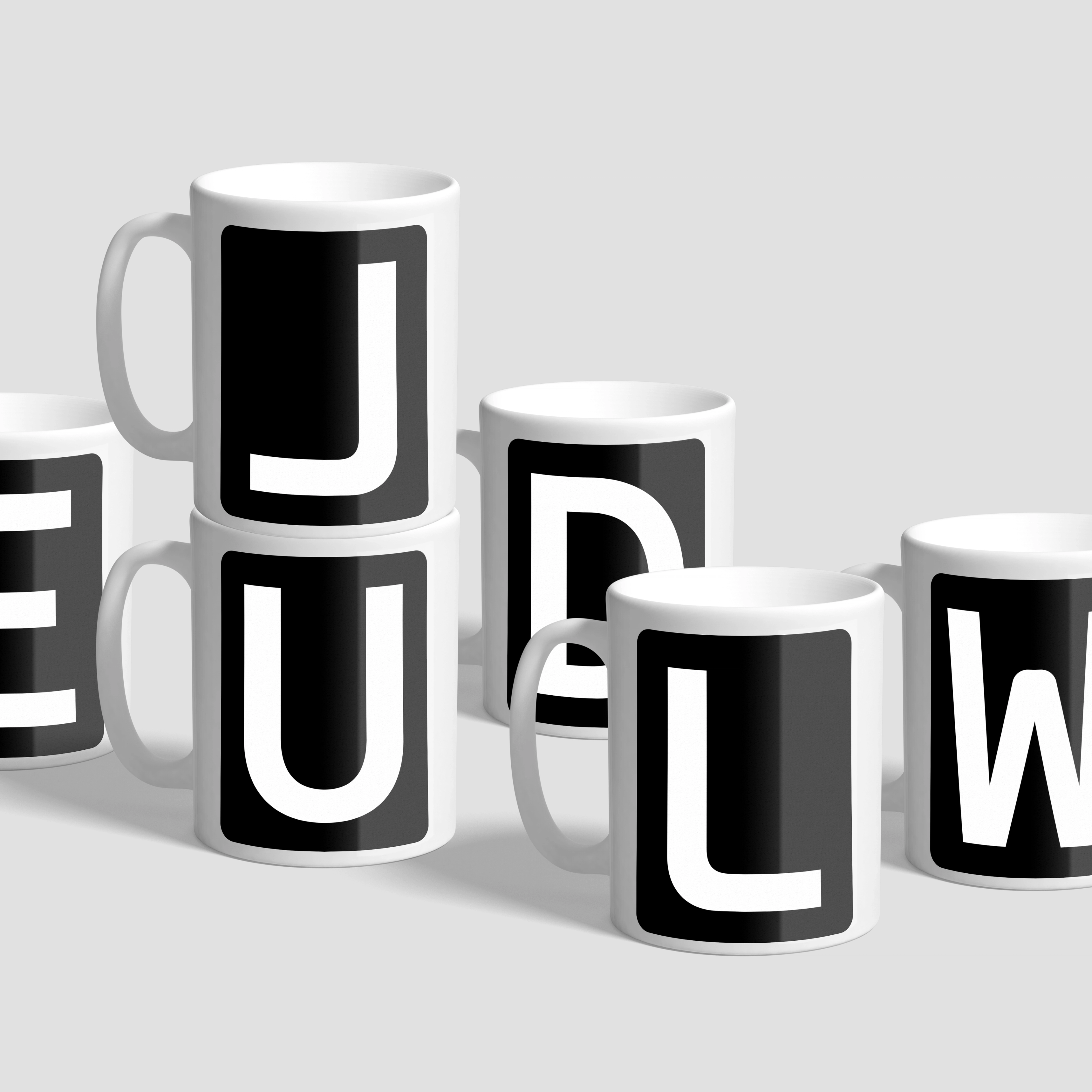 Mugs with letters on them. Copyright Cotton Design, Talia Cotton
