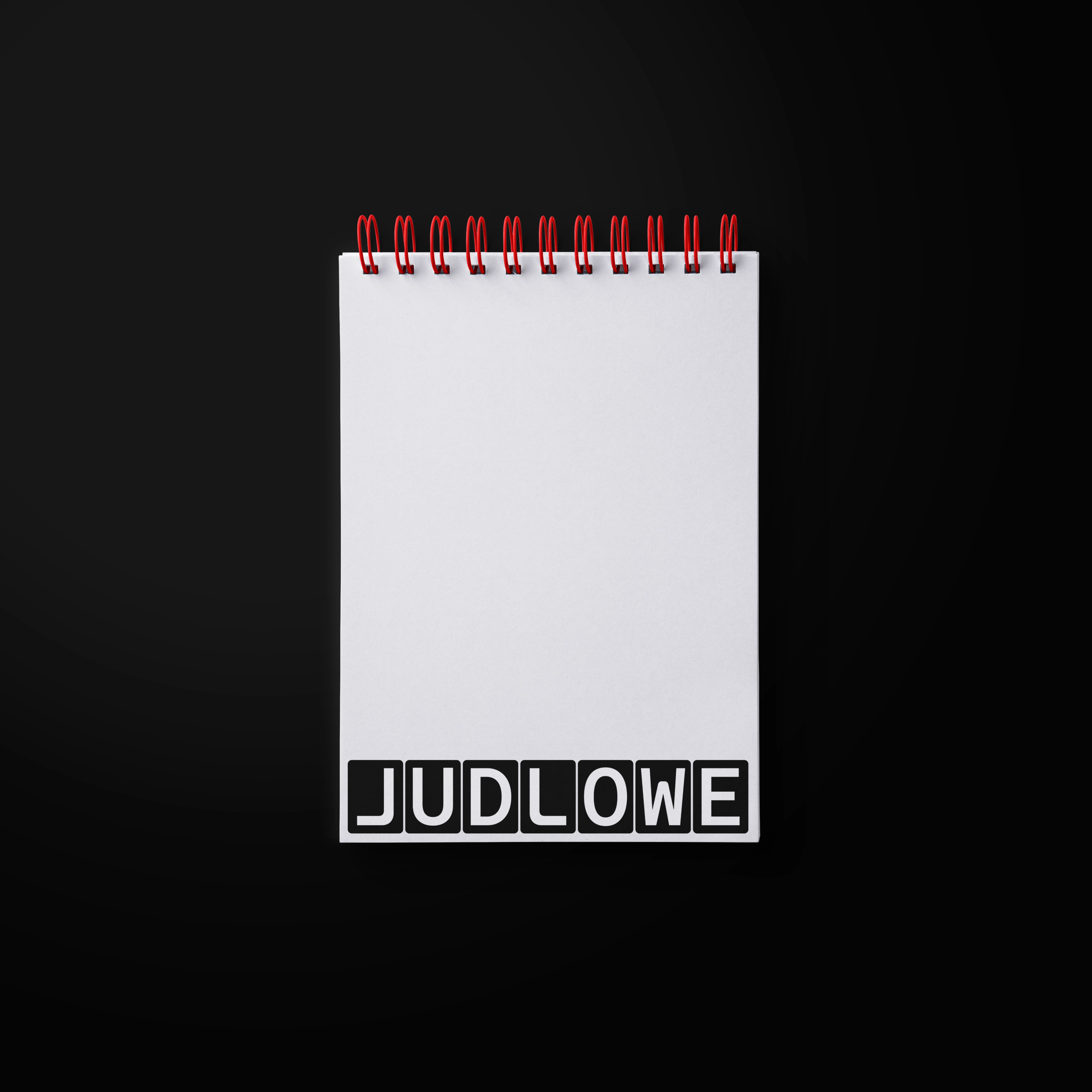 Notepad with a logo on the bottom. Copyright Cotton Design, Talia Cotton