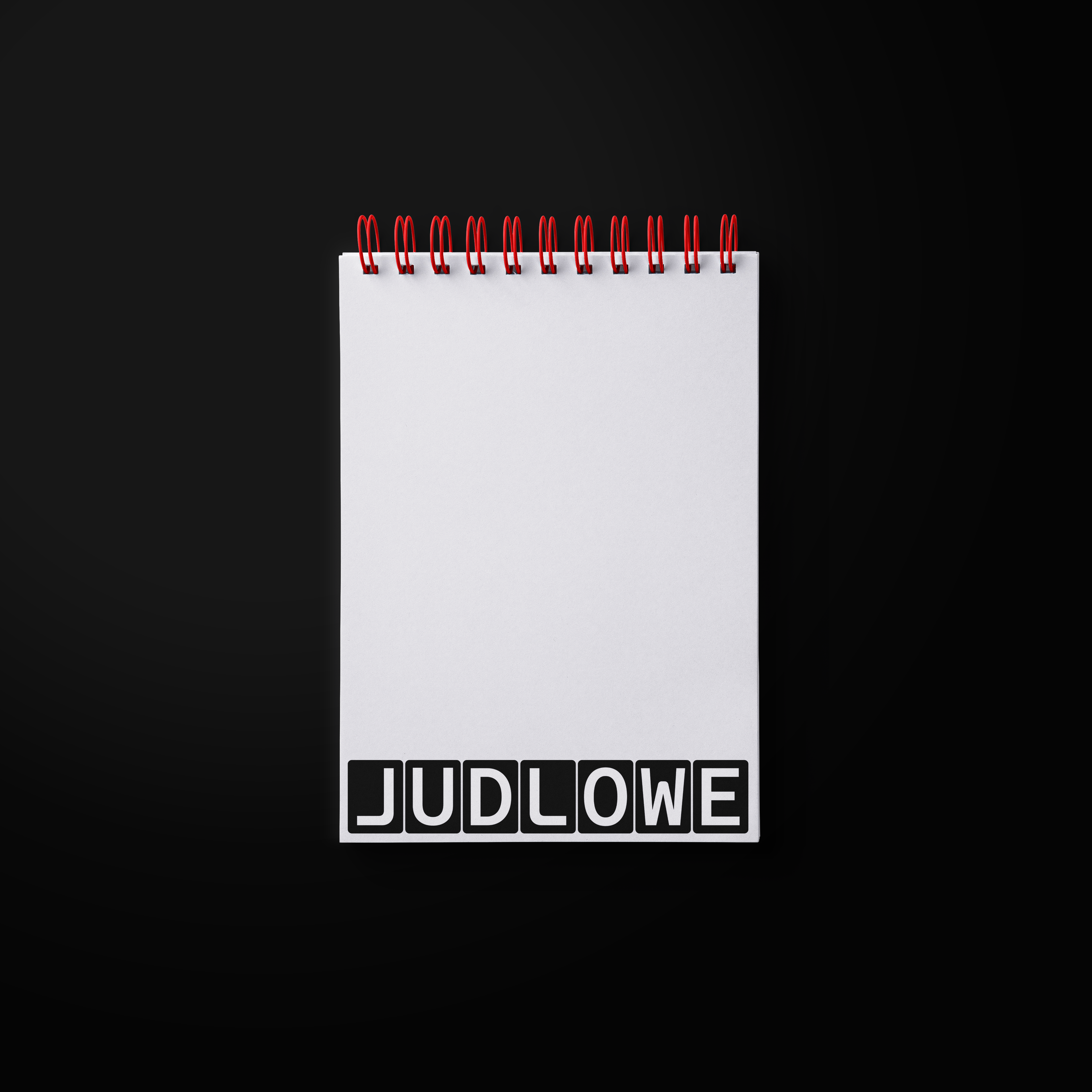 Notepad with a logo on the bottom. Copyright Cotton Design, Talia Cotton