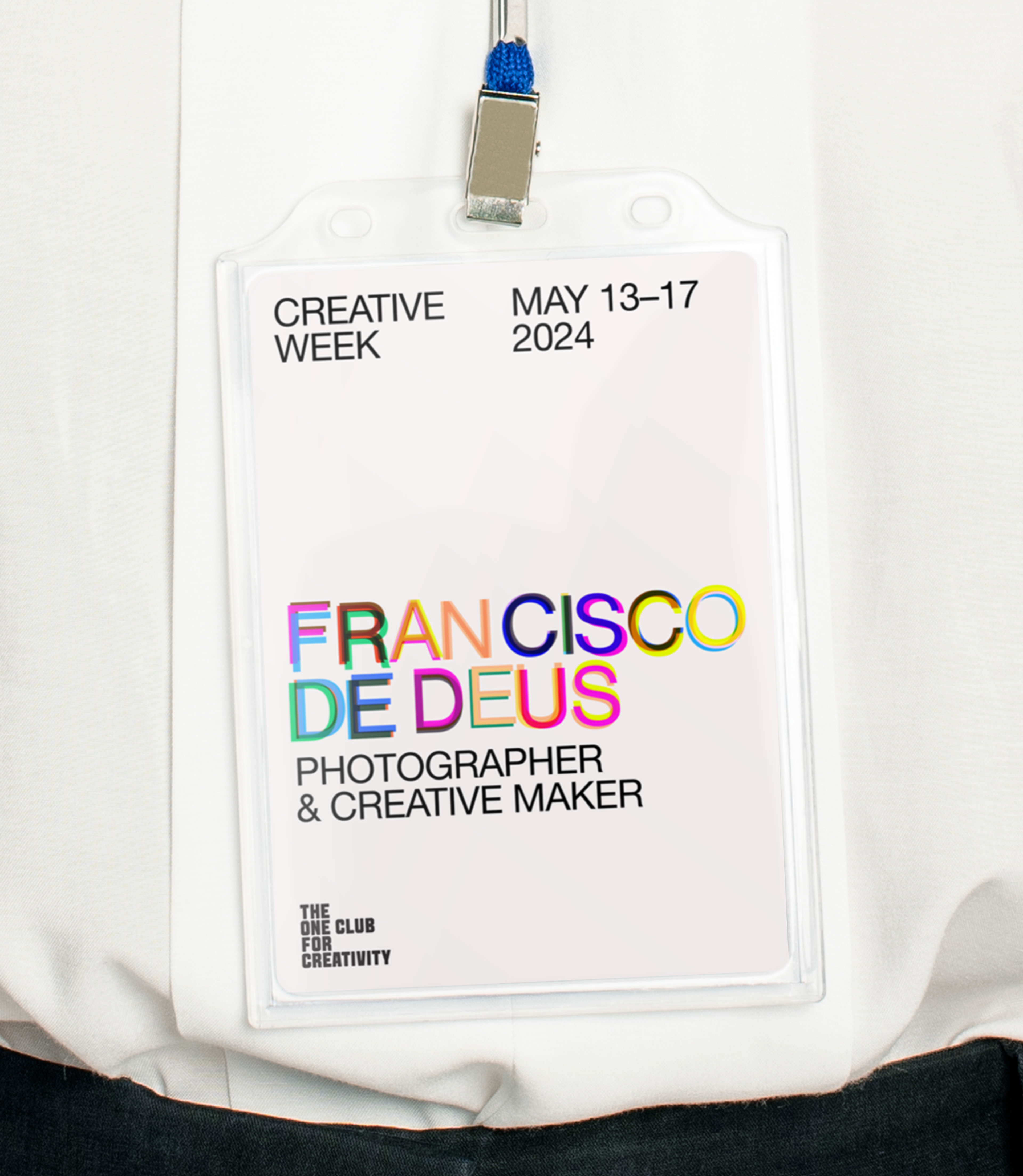 Lanyard with "Francisco De Deus" in colorful text on a white background.. Copyright Cotton Design, Talia Cotton