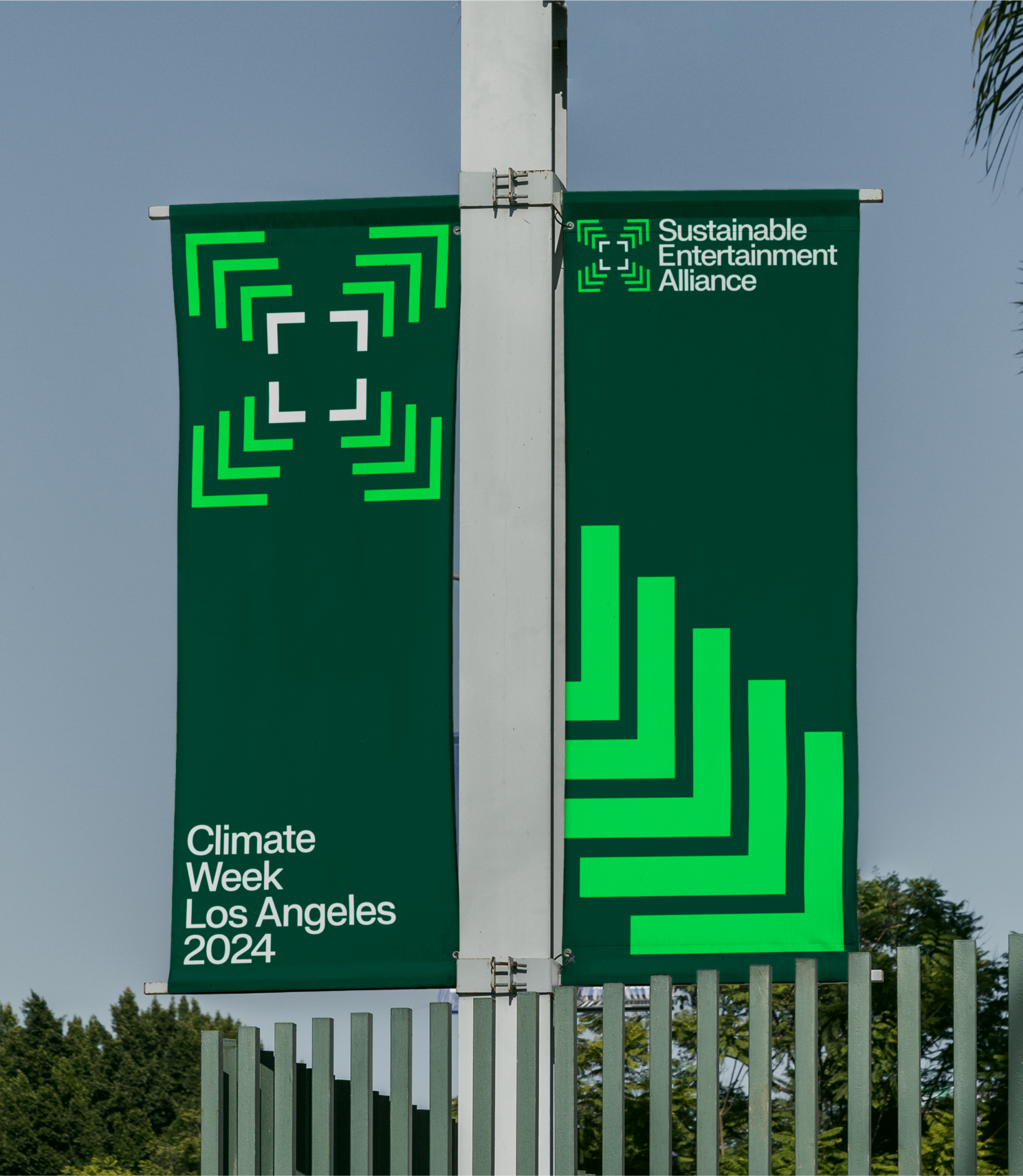 Flags that say Climate Week Los Angeles 2024 with the Sustainable Entertainment Alliance logo. Copyright Cotton Design, Talia Cotton