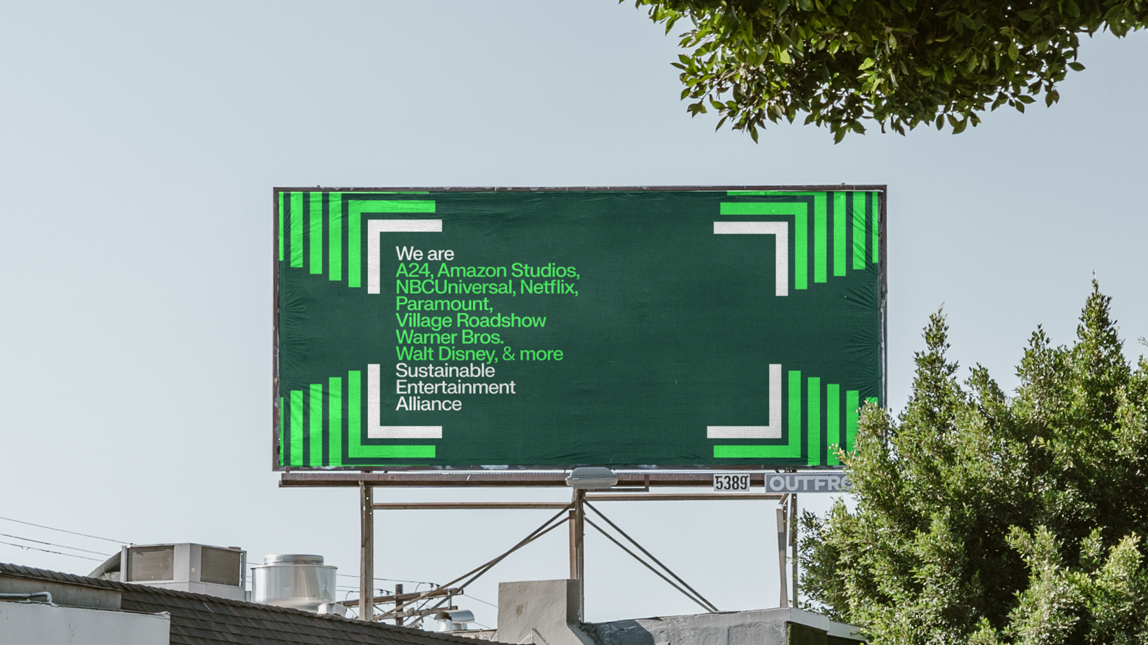 Billboard with the text "We are A24, Amazon Studios, NBCUniversal, Netflix, Paramount, Village Roadshow, Warner Bros, Walt Disney & more. Sustainable Entertainment Alliance". Copyright Cotton Design, Talia Cotton