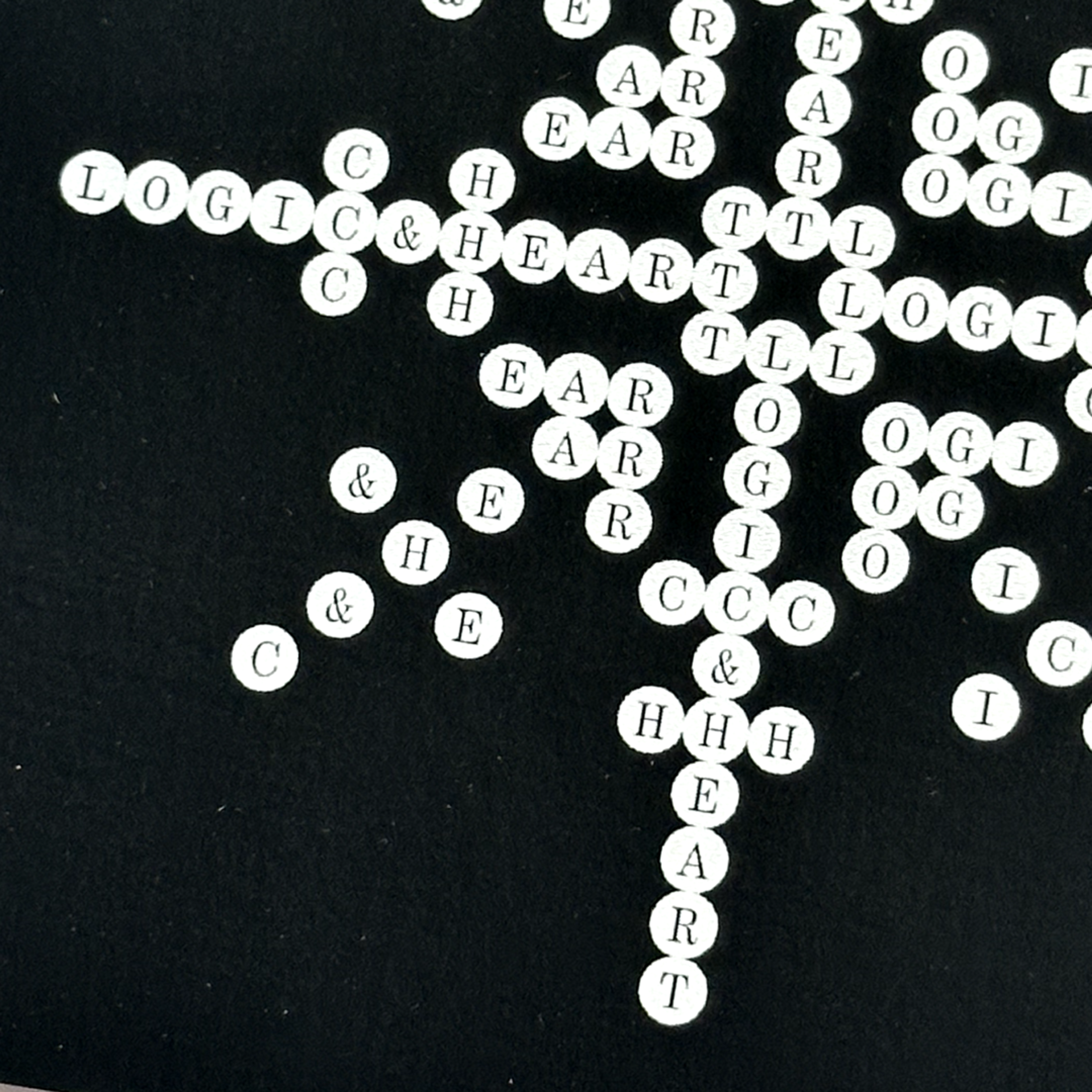 white circles with letters in them. Copyright Cotton Design, Talia Cotton