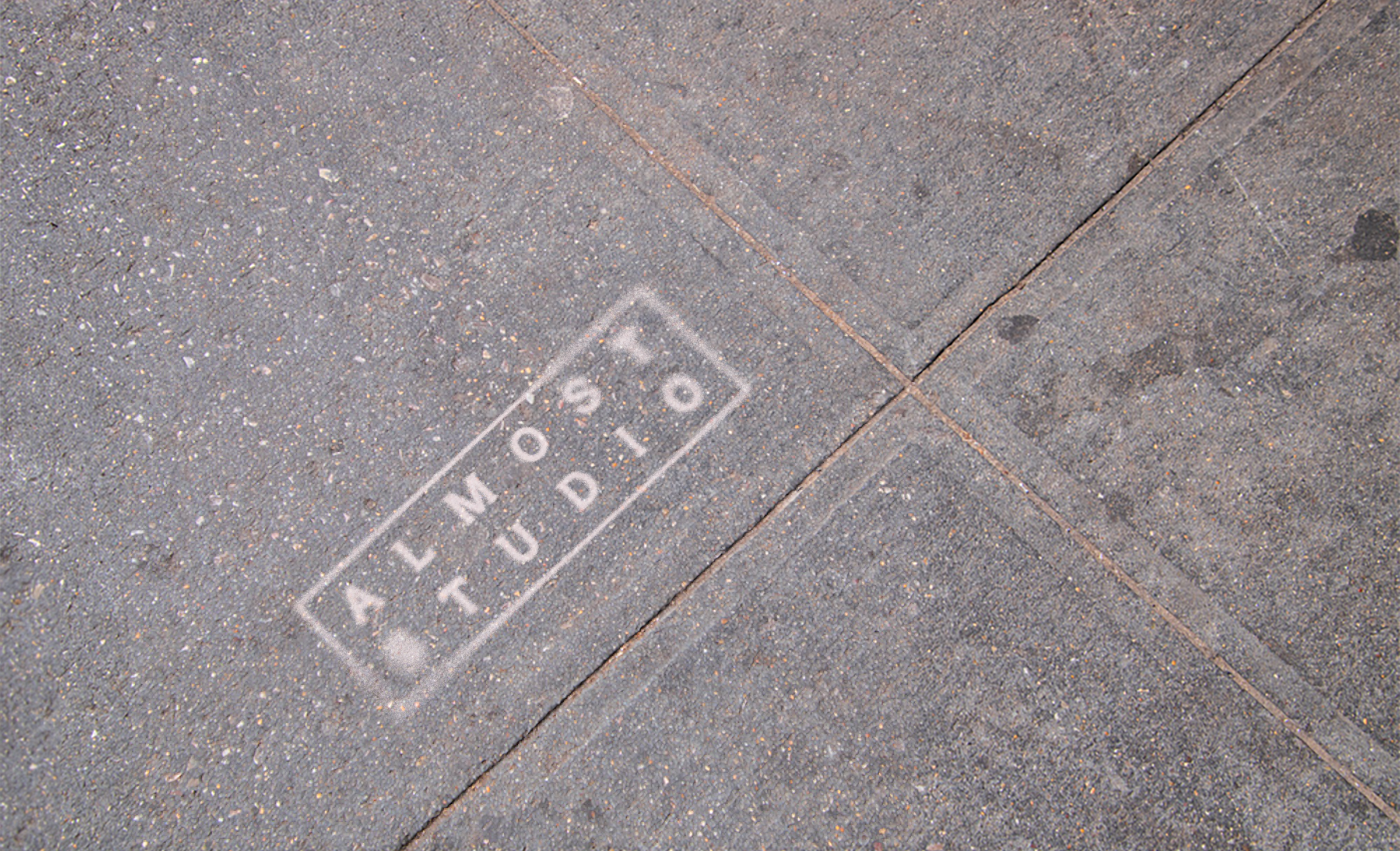 Almost Studio logo on sidewalk. Copyright Cotton Design, Talia Cotton
