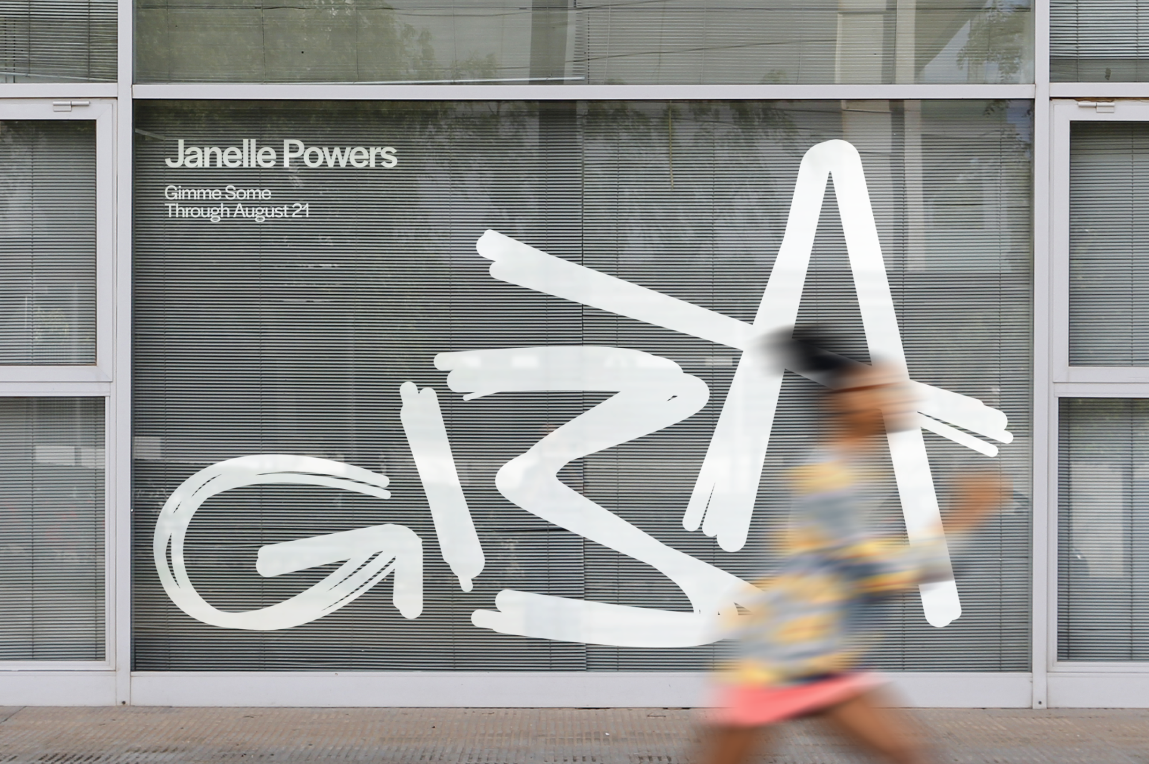 Storefront Window for GBA Guilty By Association with woman running in front. Copyright Cotton Design, Talia Cotton