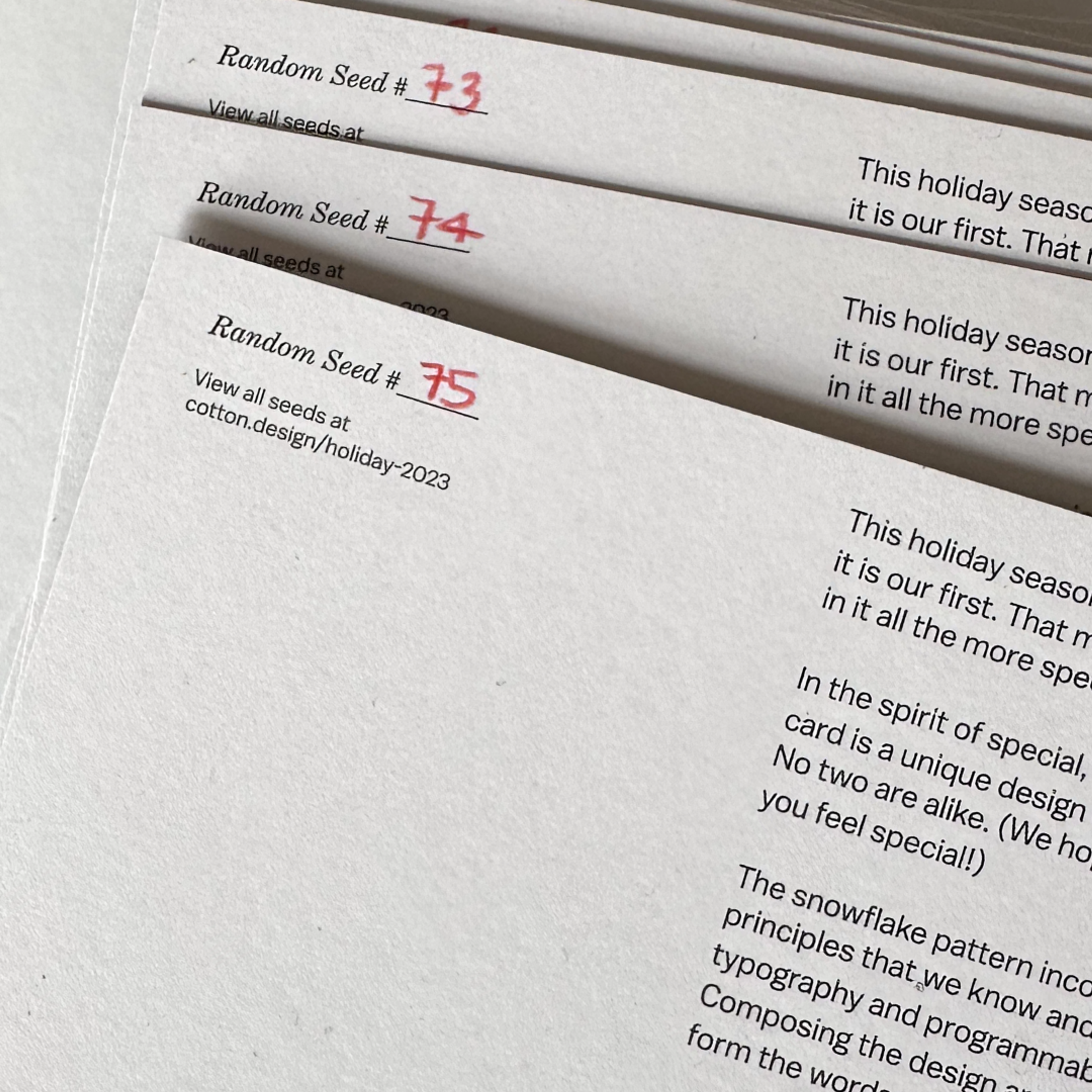 papers with text and a number written on them in red. Copyright Cotton Design, Talia Cotton