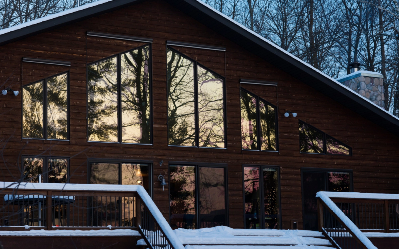 insulated home with a snowy roof