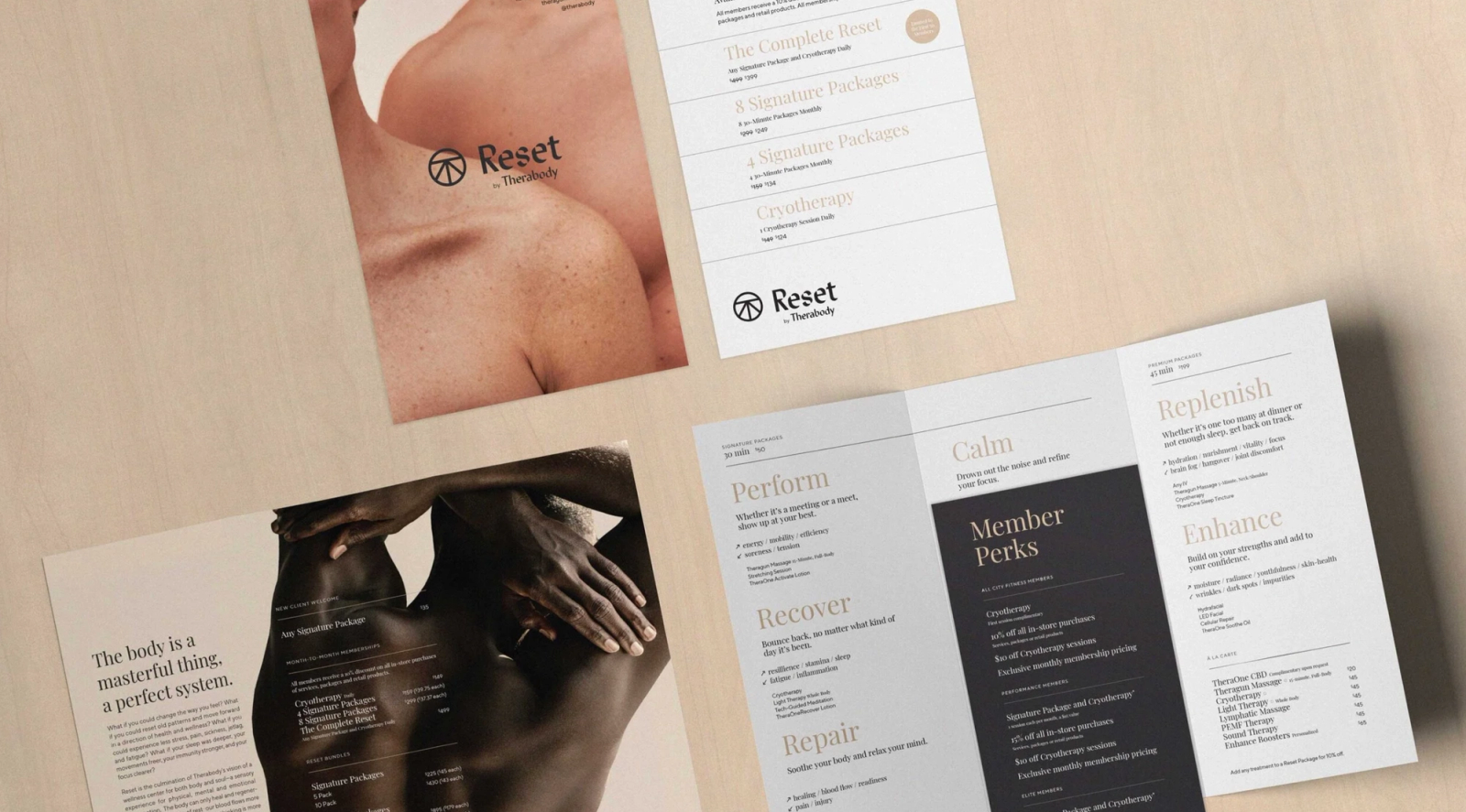 Therabody Reset spa menu and brochures on a wood surface