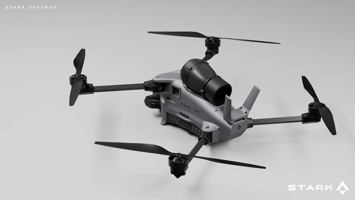 A grey Stark Defence drone with a black cylindrical module on top.