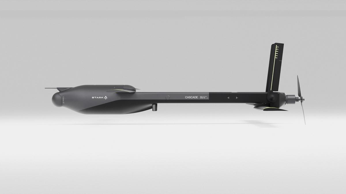 Sleek dark grey STARK.A CASCADE 500C underwater drone with a propeller and tail fin, side view.