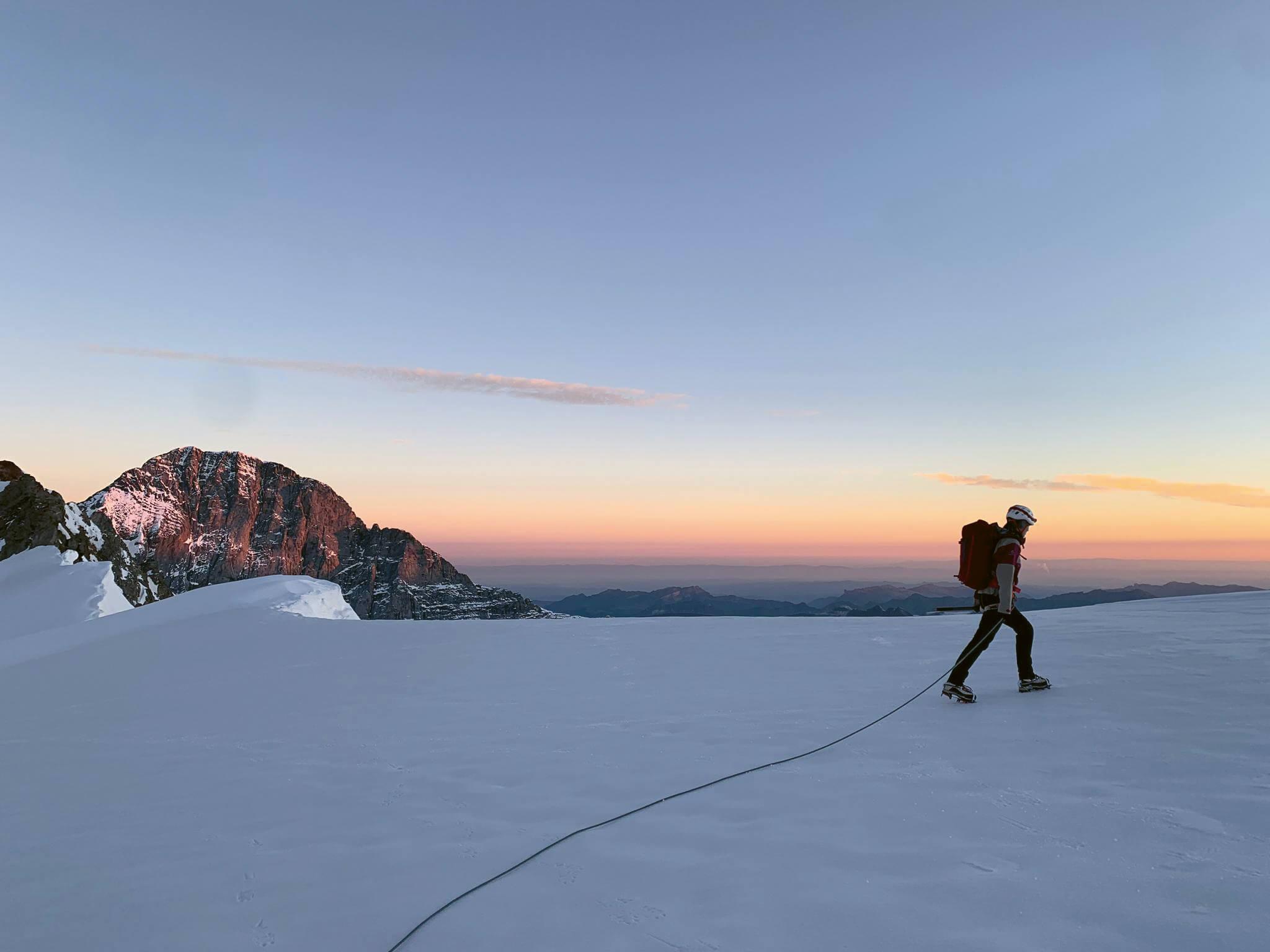 Mountaineering in the Bernese Alps in front of the Eiger mountain.