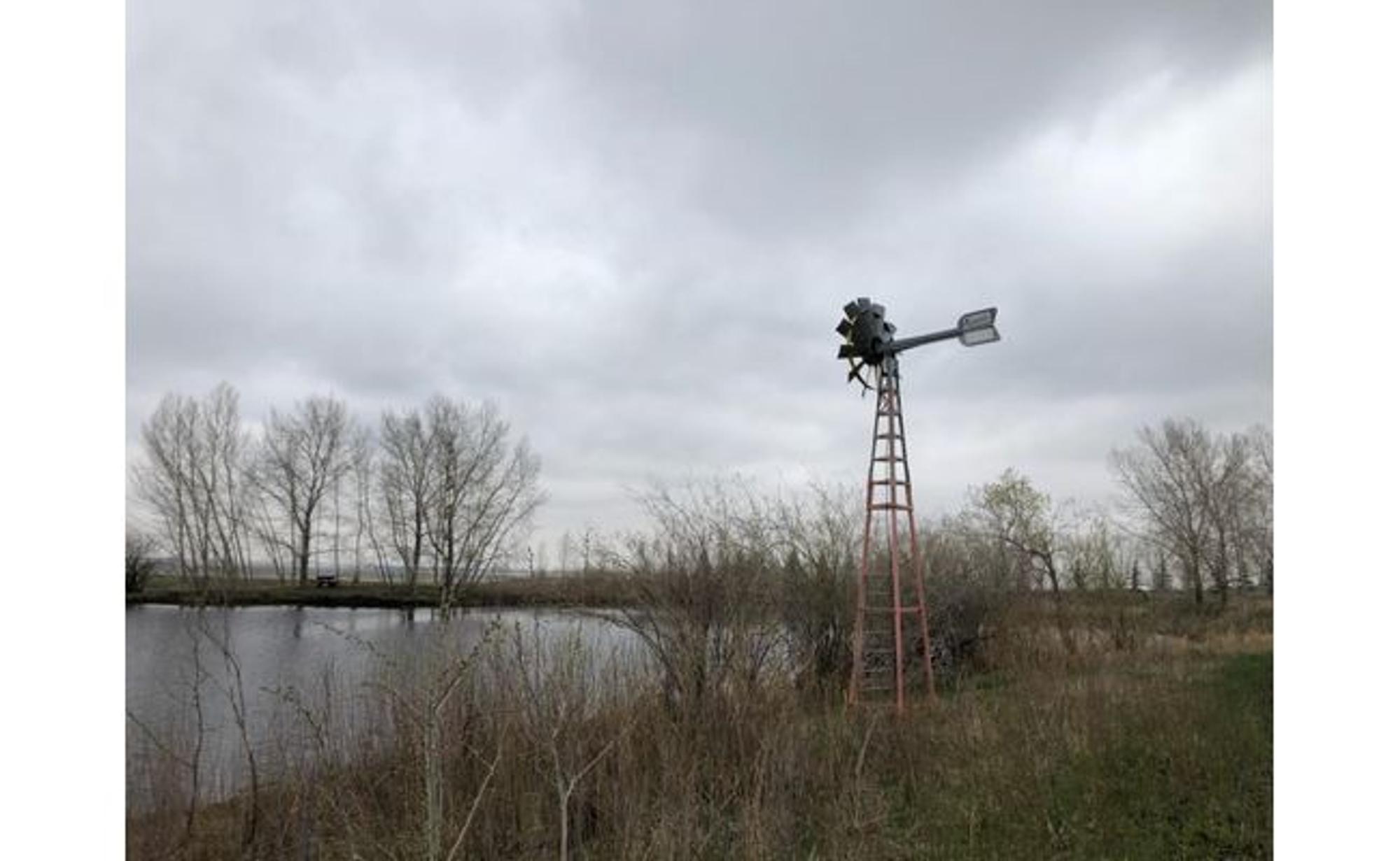 Koenders windmill aerating John's trout pond east of Calgary