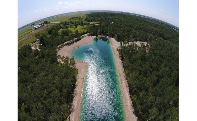 Aerial view of Francois's blue, aerated pond in Manitoba